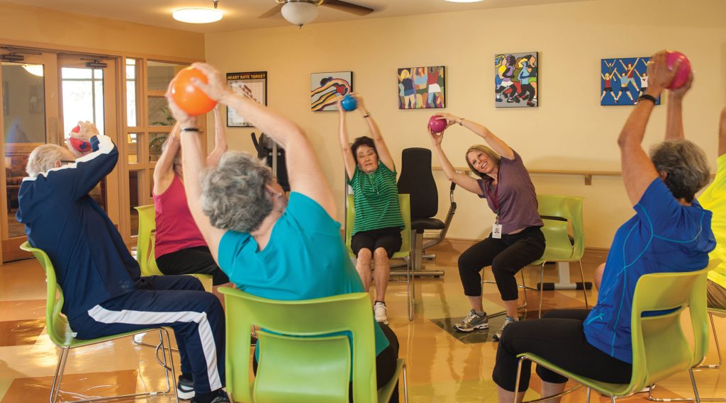 senior residents exercising at Cascades of Tucson